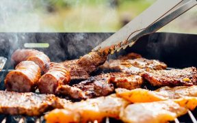 food being cooked on a brick barbecue