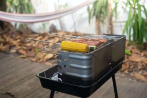 bbq corn on the cob cooking on an outdoor grill