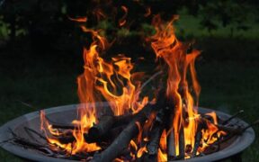 a lit fire pit rusting