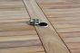 Close up of teak outdoor dining table with parasol port